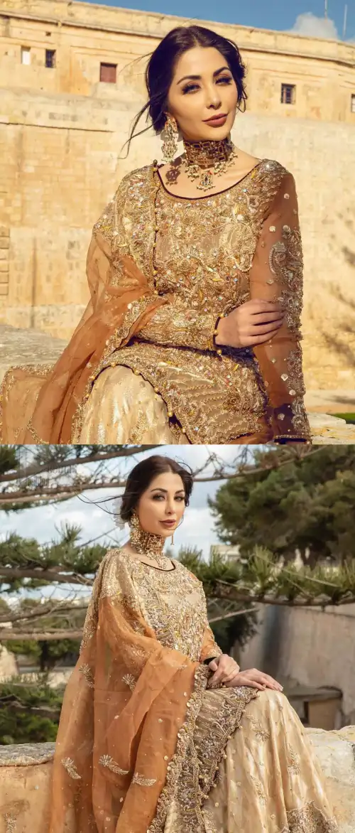 Dazzle in this made to perfection, richly embroidered ensemble accentuated with floral motifs and finished with scalp borders. Excellence of