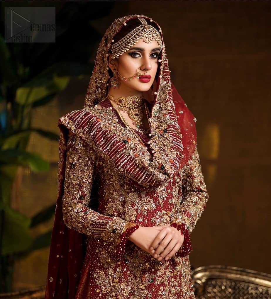 Captured in traditional silhouette. The bridal stands out due to its uniqueness and the perfect fusion of modern cut and traditional embroidery. This dress is beautifully highlighted with zardozi work in the shades of tan and silver. The hemline of the shirt is adorned with scalloped finishing and tassels on the sleeves. It comes with katan banarsi gharara with wide flare decorated with kora, dabka, tilla and pearls work. It is coordinated with organza dupatta which is sprinkled with sequins all over it. It is further furnished with four sided scalloped border.