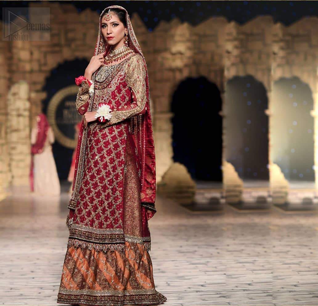 Classic, timeless and truly beautiful, our bridal dress is perfect for your unforgettable day. A perfectly pretty combination of antique and light gold embellishment, this wedding dress is elegant and eye-catching in equal measure. The bodice is crafted artfully with embellished bodice and rest of the shirt is adorned with geometric patterns. Finished with fine zardozi work on the hemline and decorative. Accompanied by a banarsi chatta patti lehenga enhanced with antique shaded kora, dabka and tilla embroidery. Finish the look with maroon organza dupatta having embroidery on all four sides.
