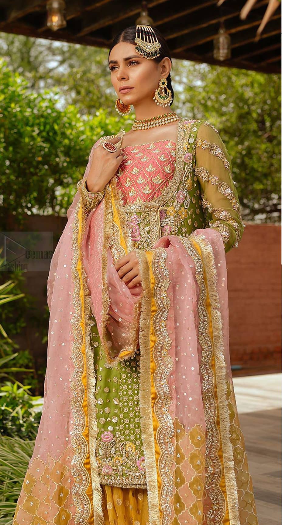 We have brought a charismatic charm to the traditional motifs and cuts. Our embroidery is rich in detailed traditional techniques executed to perfection. The bride shines bright in this outfit, embedded with sophisticated zardozi and thread embeishments. The bodice and hemline is furthermore emphasized with intricate details that gives the perfect ending to this mehndi dress. Pair it up with yellow sharara with captivating embellished border. The dupatta incorporates beautifully designed borders with zardozi, applique and kiran along the length, focusing on the geometrically embellished pallu and sequins spray all over to give it a perfect look.