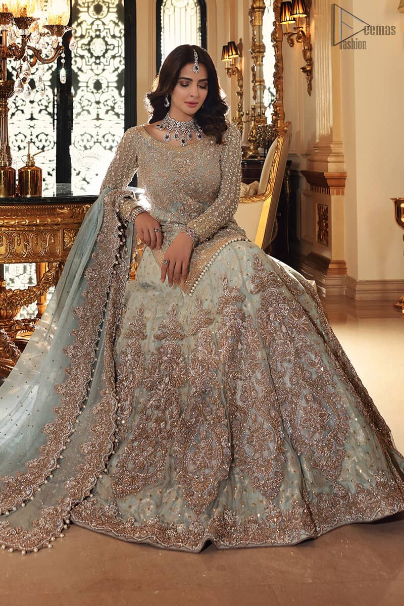 This colour is the perfect feminine and delicate shade with its meticulously crafted fabrication with the flow of organza dusted with pearls to the richness of the shirt and dupatta pallu bordered with gorgeous embroideries. Adorned with sterling sequences and silver and crystal hand embellishments, its a classic modern masterpiece. Lehenga is emphasized with two layers of fabrics, the inner layer is of banarsi and the upper layer is fully embellished with zardozi work. Embroidery is done in the shades of antique and silver. The outfit is complemented with a mint green dupatta with chann all over and finishing with handwork borders all around the edges.