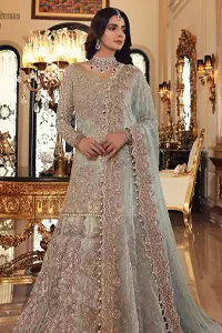 This colour is the perfect feminine and delicate shade with its meticulously crafted fabrication with the flow of organza dusted with pearls to the richness of the shirt and dupatta pallu bordered with gorgeous embroideries. Adorned with sterling sequences and silver and crystal hand embellishments, its a classic modern masterpiece. Lehenga is emphasized with two layers of fabrics, the inner layer is of banarsi and the upper layer is fully embellished with zardozi work. Embroidery is done in the shades of antique and silver. The outfit is complemented with a mint green dupatta with chann all over and finishing with handwork borders all around the edges.