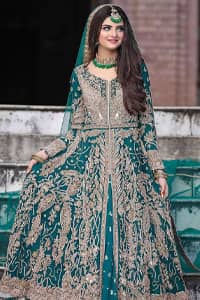 This breathtaking fit and flare wedding dress offers comfort without compromising on style. Featuring beautiful handwork, this outfit has a delicate arrangement of hand-embellished floral patterns with champagne zardozi work along the length. Refined craftsmanship is at its best with a hand embellished belt clenched elegantly at the waistline. It comes with a sea-green lehenga adorned with tiny motifs spray all over the ground and exaggerated with embroidered lace bottom. This outfit is paired up with an organza dupatta with embroidered border to give it a perfect ending.