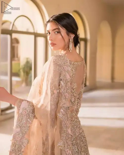 Picturing your bridal in a tea rose colour? This subtleness laden with ornamental embellishments and embroidery creates such a fairytale