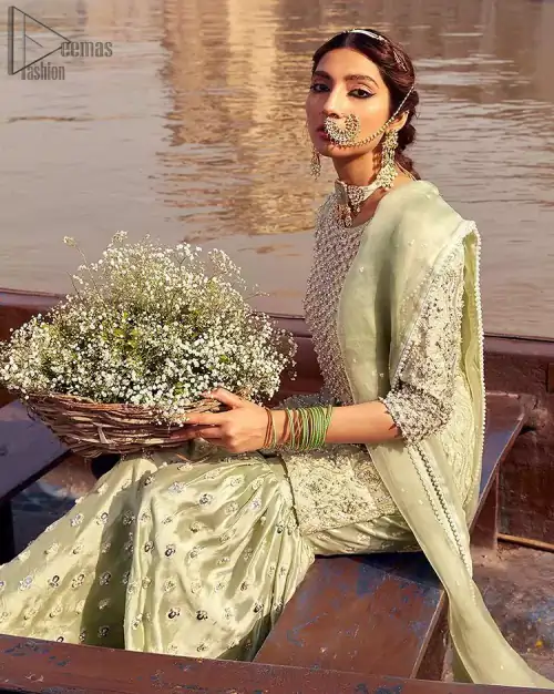 Glow up an evening formal event with a Light Parrot Green Gharara Shirt, a beautiful three-quartered sleeves shirt designed with