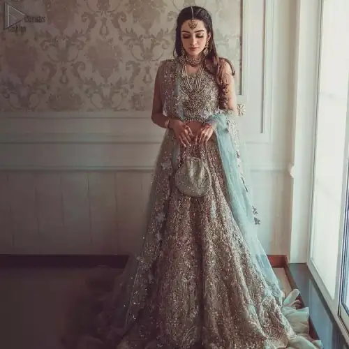 Nikah Wear - Pastel Blue Lehenga Blouse. While the pearl and sequins work all over the pastel blue dupatta contributing