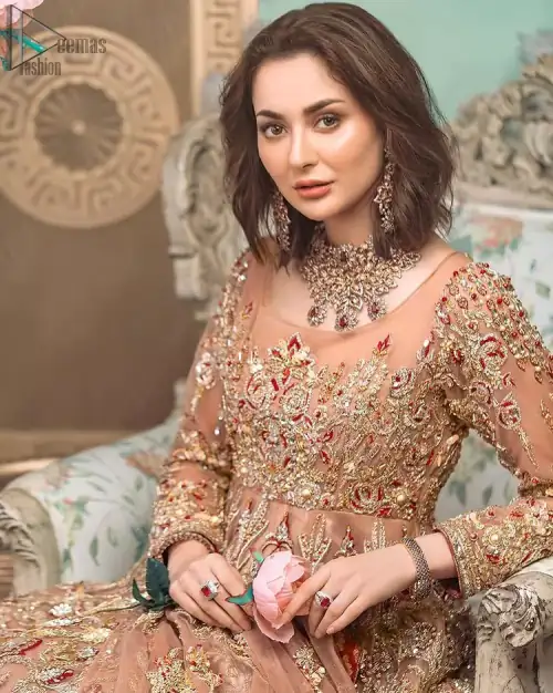 Peach Ruffled Maxi – Back Train Style Dupatta. Peach Blossoming Floral like Maxi with a frilled red border and Organza