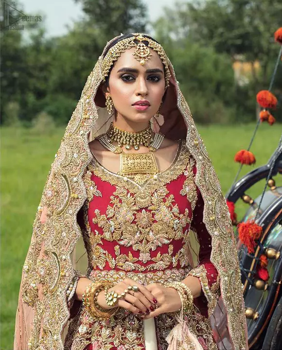 Best Nikah Dress – Red Front Open Gown Inner Ivory Lehenga Maxi. Glorify yourself by suiting up with the exceptional dress ranges from the house of DeemasFashion out of which one is here to make you graceful enough to make all jaws drop down. Red Organza with sweetheart necklined fully engraved, chantilly appliqued and giving a kind of look that you will surely love to have. Along with the elegant ivory coloured floral motifs having maxi lehenga in your drop-down menu of this gorgeous outfit. The fully embossed tea rose organza dupatta is giving major traditional vibes with scalloped borders that will surely suit your face beauty.
