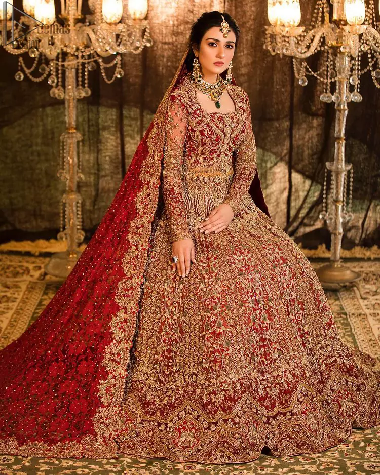 A truly exquisite ensemble that is sure to make heads turn on your big day. With a lot of attention to detail, the intricate sequencing using glass beading and threads makes the blouse look like nothing but a dream. Coordinated with a floor kissing asymmetrical lehenga adds to its charm. Intricate details, Refined craftsmanship is at its best with hand embellished zardozi work all over. Complete the look with a fully embellished dupatta adds the right amount of drama to this bridal outfit finished with scalloped borders and scattered sequins all over the ground.
