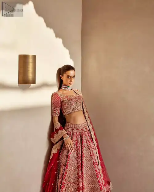 It's all about looking stunning with a gorgeous Red Lehenga Blouse on your big day. Made with pure organza, this