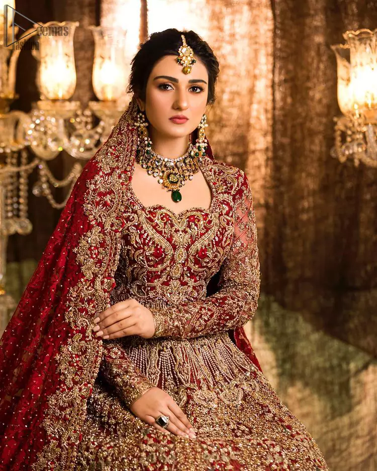 A truly exquisite ensemble that is sure to make heads turn on your big day. With a lot of attention to detail, the intricate sequencing using glass beading and threads makes the blouse look like nothing but a dream. Coordinated with a floor kissing asymmetrical lehenga adds to its charm. Intricate details, Refined craftsmanship is at its best with hand embellished zardozi work all over. Complete the look with a fully embellished dupatta adds the right amount of drama to this bridal outfit finished with scalloped borders and scattered sequins all over the ground.