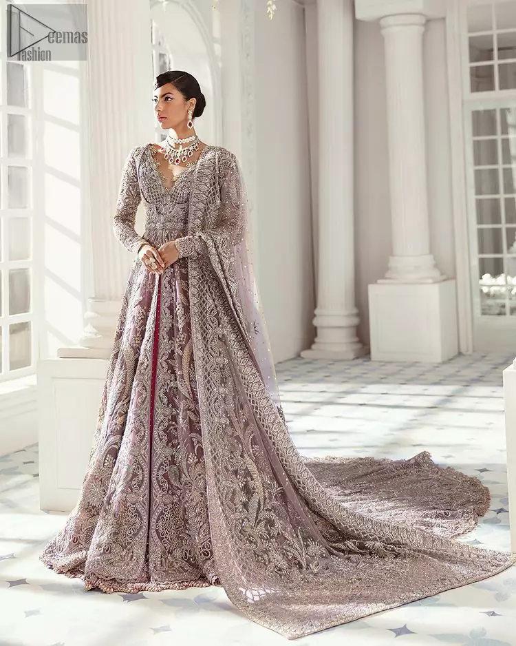 Every bride is the queen of her big day, which is why she deserves an imperial look. The Tea Pink Front Open Maxi Dupatta serves the most queenly gorgeousness with its royal full sleeves and a ravishing front open. But it's not all so simple, a complex and skilful work of silver and light golden embroidery, under its stunning V-neckline, adds more to its worth. The very meritorious back train and its exquisite dupatta with criss-cross patterns mark this exceptional attire as an embodiment of true royalty. Gracefulness along with extreme beauty is what we are looking for, hence, the dress is made with fine organza making the dress fully ready to gratify your imaginations on your Nikkah or Walima.