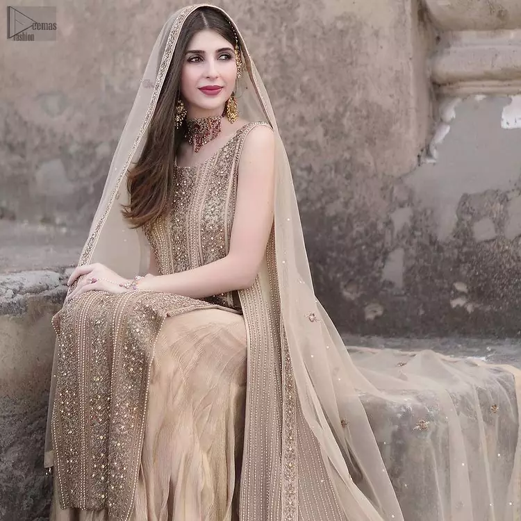 Followed by a tissue dupatta which is sprinkled with sequins all over it. Beige Long Shirt Sharara – Dupatta
