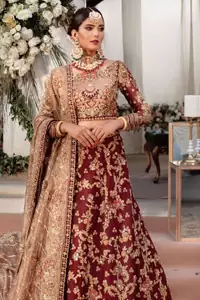 Enriched with utmost grandiose, and formed in perfection, the full-sleeved Maroon Lehenga Blouse is definitely a traditional beauty. Featuring a fascinating blouse, an elegant lehenga and a light brown dupatta, all made to achieve admiration using the purest of organza.