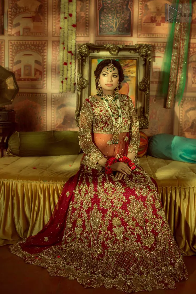 A little blend of the traditional and western styles doubles the gorgeousness of the Red Short Shirt Lehenga. A dress with such dexterity that it holds the magic towards a gorgeous wedding day. Its can-can style and cultural styled full-sleeves are indeed a contribution to the overall exceptional beauty of the dress. Purest organza as the most graceful as well as the comfortable fabric is chosen by our professional designers for this highly ravishing attire. As per the dress’s need, a boat-shaped neckline appears admirable, while the exceptional work of golden embroidery assures you of the lots of attraction you’ll receive on your Reception day.
