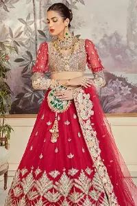 This unique traditional Pakistani bridal wear is all set to beautify your wedding day. An attire made with such perfection, that every little detail speaks of its magnificence. The red Lehenga Blouse comes with full sleeves and is made with the purest organza, while a sweetheart neckline follows mesmerizing light golden embroidery, giving the dress a touch of glamour. A perfect treat to your reception day.