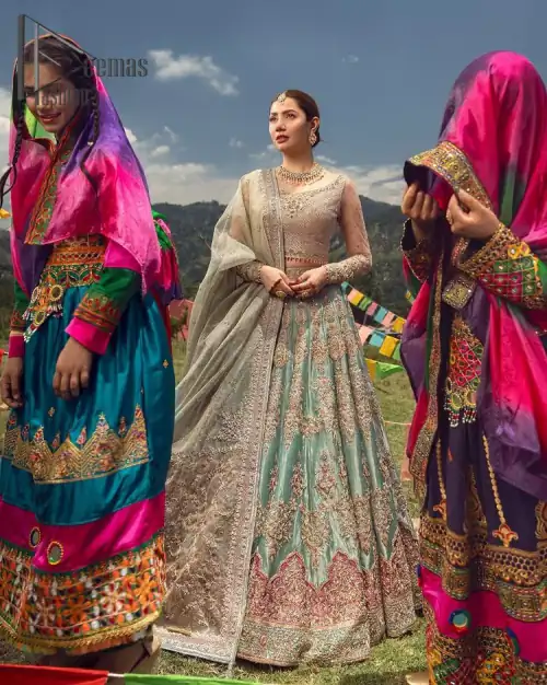 Talking about traditional, Deemas Fashion introduces the Aqua Lehenga and pink blouse which is an outstanding upgrade to bridal wear.