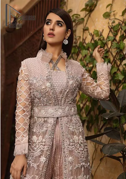 Nothing spells magic quite like a tea rose outfit on your Big day. An engrossing shirt and crushed sharara style provide unparalleled majesty and impressiveness to the overall dress code all made with the purest of the organza. This tea rose full sleeve shirt is heavily embellished with silver embroidery that includes pearls, kora and dabka work. Our attire and the way we put ourselves together sometimes speaks louder than our words. So, we set it up with  tea rose crushed sharara to balance the magical fairytale look.
