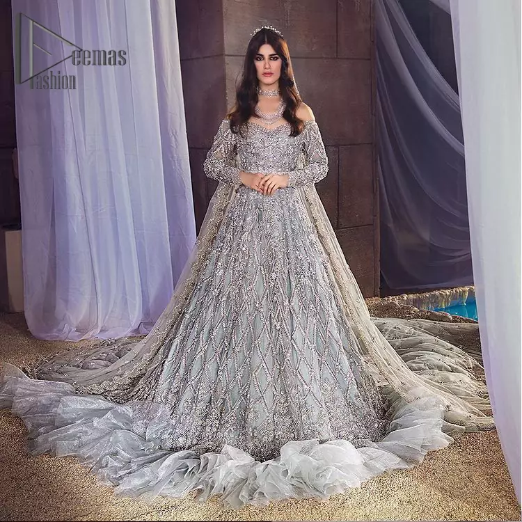 This fairy-tale ensemble is everything that you need to impress everyone at your  Walima ceremony. This off-shoulder frilled maxi is adorned with a fully embellished bodice, sleeves and fully embroidered daman is giving a perfect ending to this flare. The frilled maxi is adorned with a deep round neckline and comprises a pure D shape dupatta that looks super artistic look.