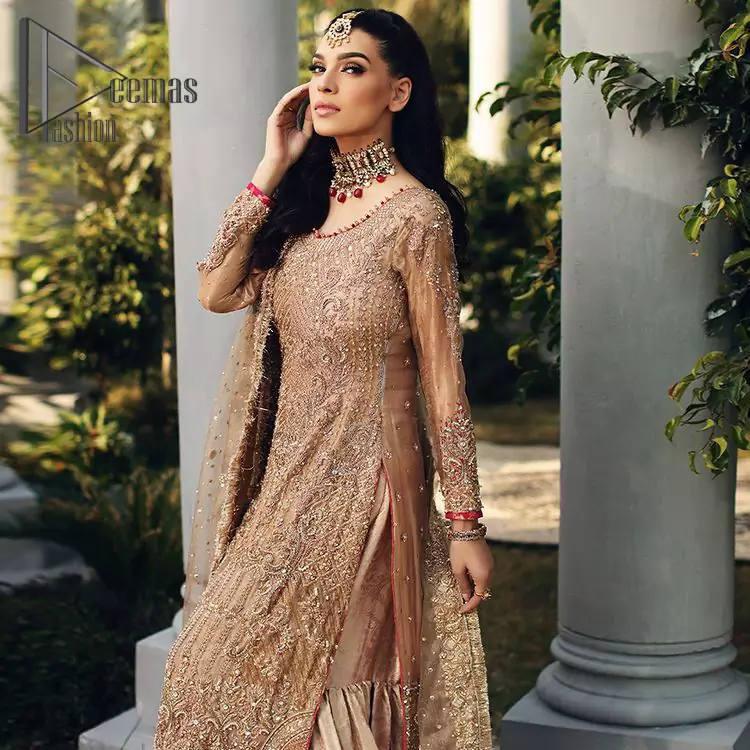 As Love Struck is a true wink of adoration so every nikkah bride is an emotion of love and a glimpse of glory shines when comes to fawn colour just like a diamond. This fawn long shirt is attractively decorated with antique embroidery that includes tilla, kora, dabka work just to give you a loving and attractive look. It is glamourously prominent with a round neckline and full sleeves as every bride wants. Pair it up with priceless fawn Gharana which is made with pure Katan banarsi jamawar. Finish this outfit with a fawn dupatta that is adorned with a four-sided embellished border and beautiful Kiran lace as well.
