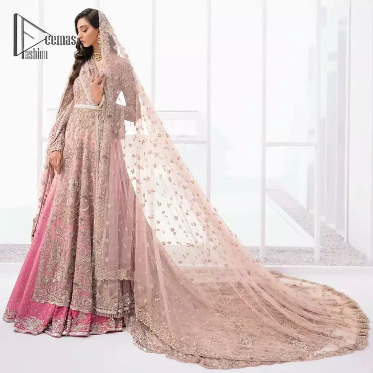 There is nothing more magical than wearing pink color on your walima. Our pink side slit open maxi is handsomely embellished with the magic of silver embroidery that involves kora, antique, dabka , sequins, and pearls just to give you dream fairy look. Further, the back train of the maxi is granted you the super dazzling effect. It is beautifully organized with a pink dupatta that is embellished with four-sided borders. Further, the dupatta is highlighted with the spray of tiny floral motifs all over just to enhance the fairy look.