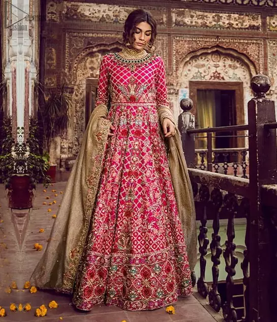 Feminine beauty needs delicate care, henceforth, Deemas Fashion introduces the most iconic bridal wears, enriched with exquisiteness at its rapture. The Mehndi Wear Shocking Pink Blouse Lehenga is the finest choice considering its gorgeousness and comfort. The dress is meticulously designed in full-sleeves, keeping the ancient royal touch preserved while the multicolour embroidery under its the extremely admirable round neckline, is just the right traditional flavour to the dress’s ravishing. The designers made sure to choose the finest fabric, which is why the overall attire is made to perfection by using the purest organza. Concluding this paragon of beauty, a net dupatta sets the dress complete to glamour up your Mehendi or Walima.
