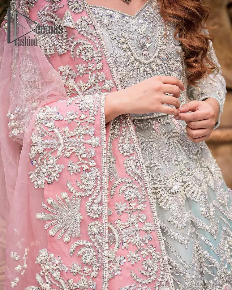 Need a quick fantastic pick for you walima? So you're in the right place. DeemasFashion presents mint green heavy maxi that is delightfully ornamented with silver embroidery that includes kora, dabka, pearl, antique, and crystal work just to give you a lovely and pleasing look. In addition to this, the V neckline of the maxi is super stunning when comes to the combination of attractive full sleeves. It is coordinated with a pink dupatta that is embellished with four-sided beautiful embroidery just to steal your special one's heart on your walima day.