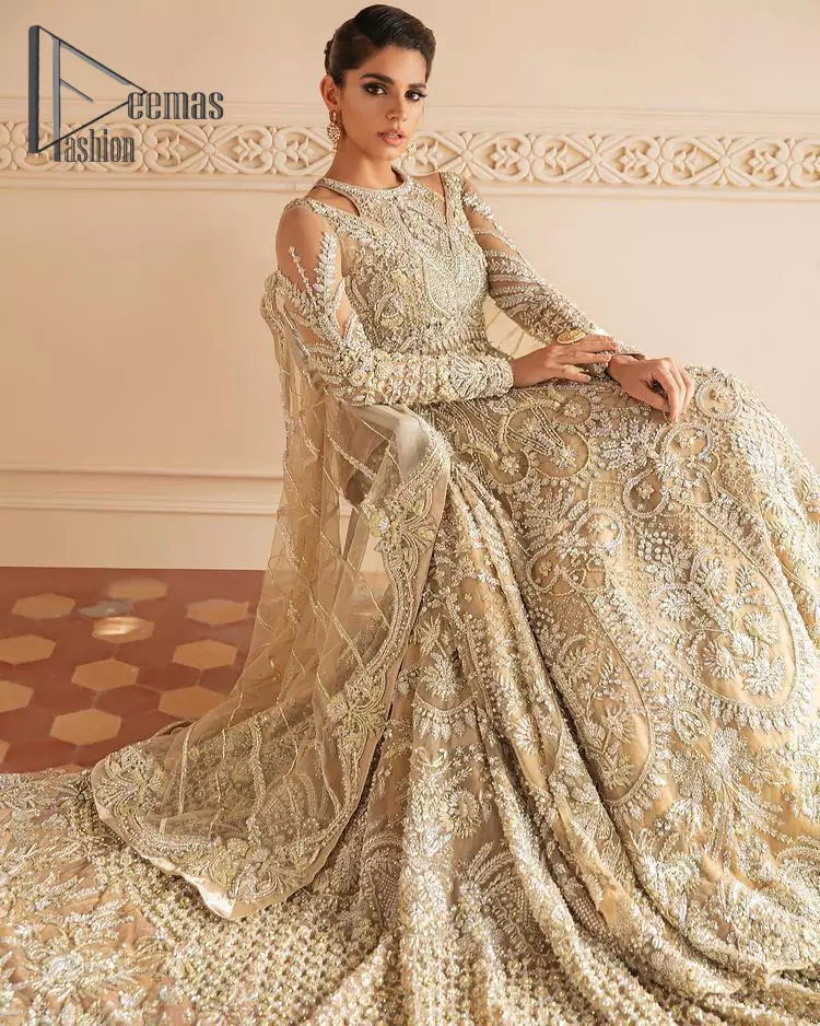 Something to Beige about! This article is specially presented by DeemasFashion featuring thoughtfully designed ensembles with a rich beige colour maxi and dupatta that are flattering on the body's quintessential details. The round neckline of the maxi is attractively combined with the back train that is heavily adorned with silver dabka, tilla,m zardozi embroidery for the finest look. In addition to this, it is paired up with the same colour dupatta that is again ornamented with \a four-sided border and sequins spray all over to fulfil your finest promising look on your walima day. 