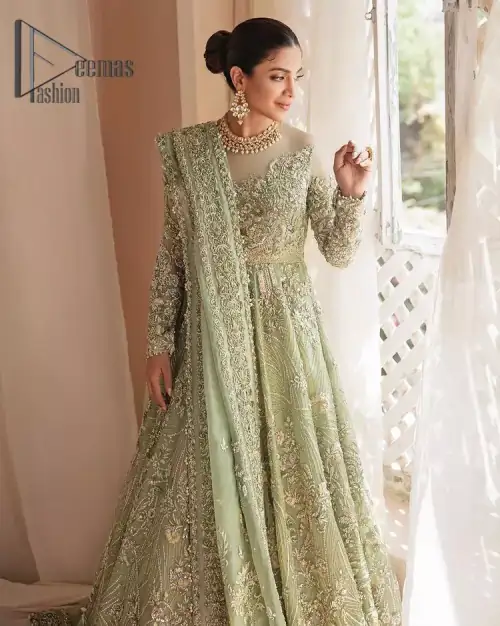 A time of life that is not just an occasion but a celebration. A pastel green scalloped maxi laboriously frosted