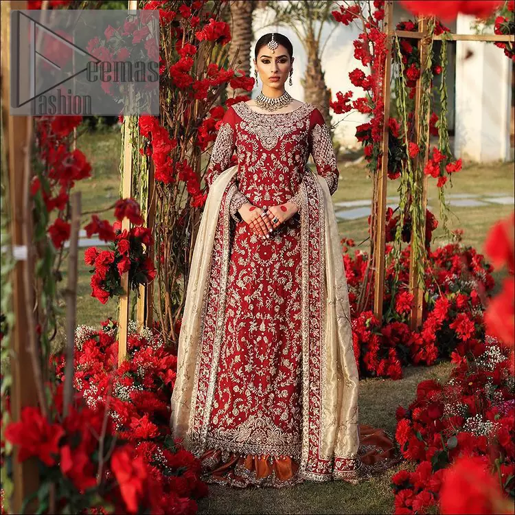 She's headstrong and rebellious, determined to divert the pacts of tradition on her Big day. Presenting a Red long shirt of DeemasFashion which is attractively ornamented with silver embroidery which involves kora, dabka, and zardozi work. It is especially highlighted with full sleeves which enhance the charmless of the article when combine with boat shape neckline. Pair up with an orange back train lehenga which is made up of pure jamawar that gives a super aesthetic and traditional look to every bride. End up this lovely look with a light golden dupatta which is embellished with a four-sided border just to fulfil the traditional gentle look. 