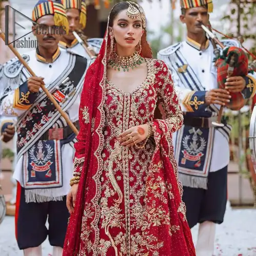 The majestic red signs a melody just for you. The handsome scalloped frock is made in the richest shade of