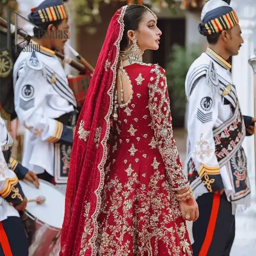 The majestic red signs a melody just for you. The handsome scalloped frock is made in the richest shade of