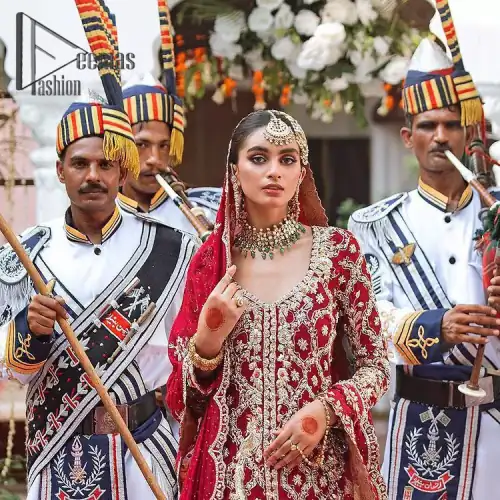 The majestic red signs a melody just for you. The handsome scalloped frock is made in the richest shade of