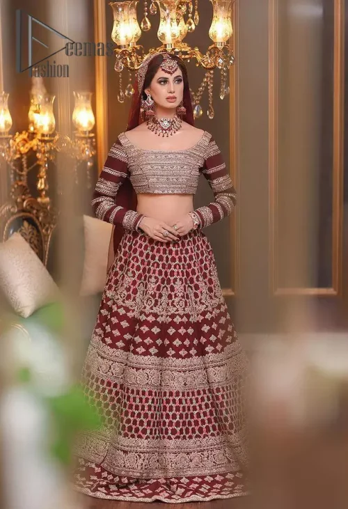 Attain your expectations on your big day with this dress. The classically vibrant combination of red and gold is a