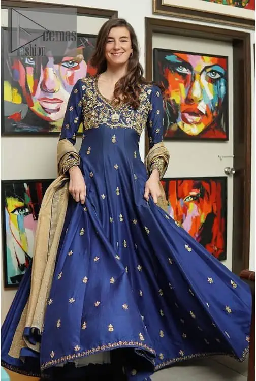 Hues of blues make a funky yet amazing pattern on amazing events. DeemasFashion introduces a navy blue outfit. Starting this article with a navy blue multiple panel frock which is ornamented with golden embroidery. The pattern of embroidery begins with the round neckline which is handsomely embellished with tilla, dabka, kora and Kundan. It is further prominent with full sleeves. The rest of the frock is decorated with floral motifs in a golden hue. The following frock comes with a golden dupatta to complete the admiring look on any day or night event. 