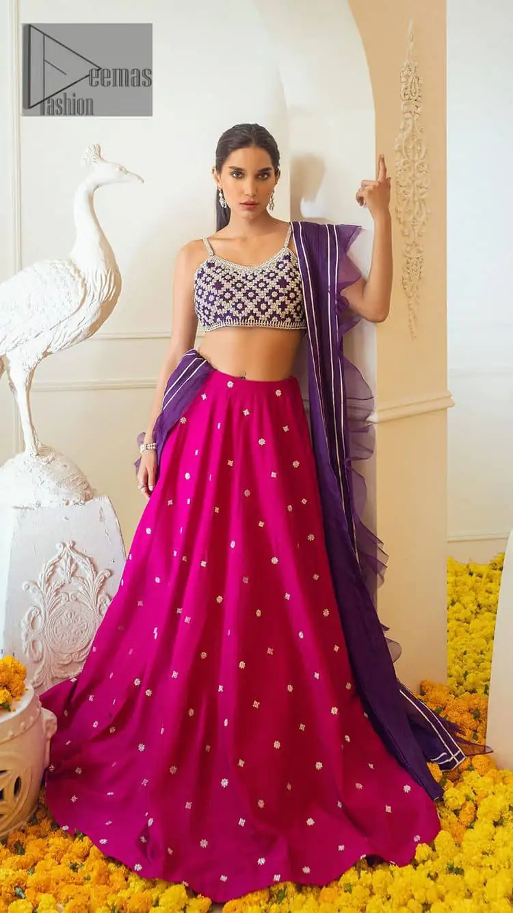 The magenta and purple imitation of traditional crafted patterns on the luxury outfits. The beautiful purple blouse is rendered with handsome silver embellishment. It is highlighted with kora, dabka, crystal and zardozi embroidery. The sleeveless style gives an attractive layer when comes with a strap neckline. The following shirt comes with an intricately embellished magenta can can lehenga to embrace the superstar look. Complete this article with an exquisite purple dupatta adorned with a lushly encrusted border. The beautiful frill in the same hue is also attached.