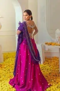 The magenta and purple imitation of traditional crafted patterns on the luxury outfits. The beautiful purple blouse is rendered with handsome silver embellishment. It is highlighted with kora, dabka, crystal and zardozi embroidery. The sleeveless style gives an attractive layer when comes with a strap neckline. The following shirt comes with an intricately embellished magenta can can lehenga to embrace the superstar look. Complete this article with an exquisite purple dupatta adorned with a lushly encrusted border. The beautiful frill in the same hue is also attached.