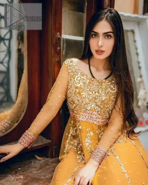 Mustard is just associated and boosts your Mehandi.  Presenting a dreamy mustard frock with a heavily embroidered bodice on a