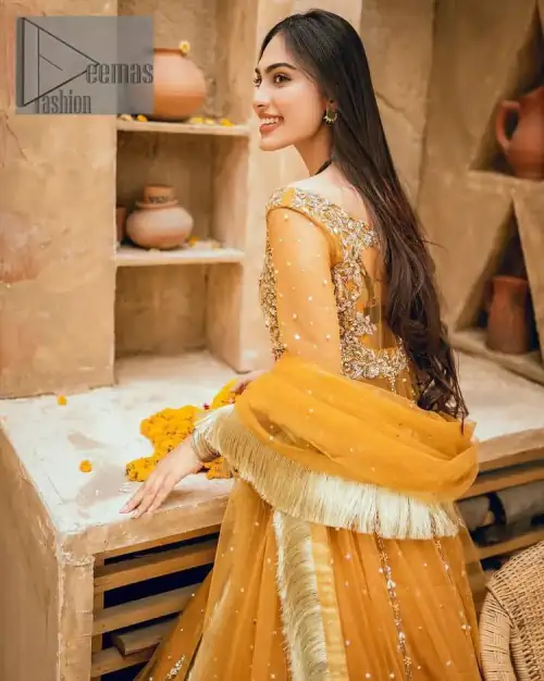 Mustard is just associated and boosts your Mehandi.  Presenting a dreamy mustard frock with a heavily embroidered bodice on a