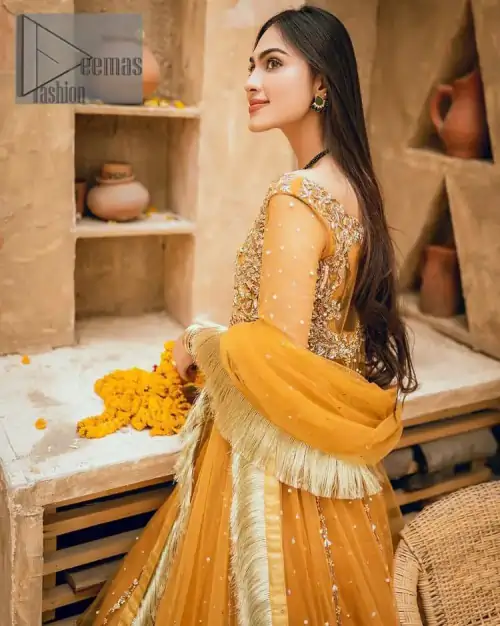 Mustard is just associated and boosts your Mehandi.  Presenting a dreamy mustard frock with a heavily embroidered bodice on a