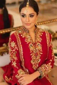 The forever favourite red dress channelling your inner diva. A luxury red long shirt rendered with intimate embroidery in golden colour to make your event blazing and remembering one. It is highlighted with tilla, dabka, kora and pearls that are a perfect blooming outfit in our collection. The collar neckline and full sleeves add attractiveness to the outfit. It comes with black pant to give you a more formal look at any precious event. The border of the pants is adorned with golden embroidery as well. End up this look with red dupatta which is embellished with a four-sided border and sequins spray all over for your constant love for red.