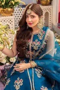 Blue defines your beauty and glows your face at any event.  Starting this article with teal blue front open pishwas that are decorated with handsome golden embroidery placed like floral motifs. It is prominent with tilla, dabka, kora and Kundan to enhance the gold in blue. In addition to this, it is styled with a sleeveless and round neckline to make your day better and the best. The following pishwas are coordinated with a can-can lehenga whose border is again adorned with heavy embellishment  Complete this party look with a teal blue dupatta that is rendered with four-sided borders and floral motifs all over to put a glow on your face.