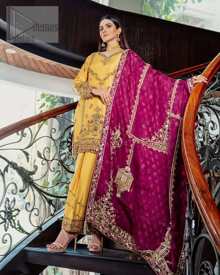 Yellow has the ability to take all the attention. Deemasfashion presents a yellow and pink outfit for your Mehandi. Starting this article with a yellow shirt that is handsomely decorated with golden embroidery and prominent with tilla, dabka, kora and zardozi to make your look super unique and perfect. Further, the following shirt is paired up with yellow straight trousers whose border is again rendered with golden embroidery. Complete this article with a magenta dupatta embellished with intimate border embroidery to gain all the attention of the event.