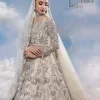 The mind wears the colours of the soul, as a beige of those of his master. Starting this nikah outfit with a beige frilled maxi which is laboriously hand-rendered with silver embroidery to fulfil the fairy dream of every bride. Furthermore, it is enhanced with tilla, dabka, kora and crystal which magnifies the beauty of this nikah outfit. The illusion neckline looks as amazing when comes with full sleeves as the moon with stars. The maxi of this nikah outfit is systemized with a lehenga in the same colour which is proof of uniqueness. Complete this nikah outfit with a dupatta in the same colour having a four-sided embellished border and sequins sprayed all over.    