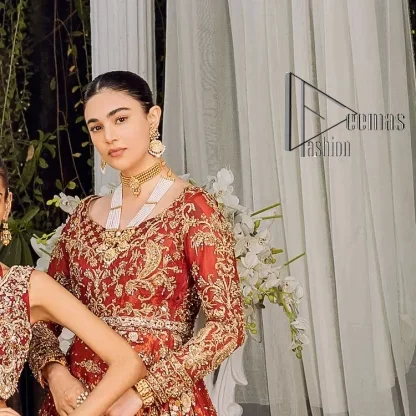 Feels just redish on your Big day to make your day lovely and romantic. DeemasFashion presents this Pakistani reception wear for you in bright red colour which begins with a flared back train maxi. The maxi is attractively and laboriously adorned with golden embroidery that enhances tilla,dabka, kora and Kundan. In addition to this, the boat shape neckline intensifies the beauty of this Pakistani reception wear when comes with full sleeves. The flared back train of the maxi is also heavily embellished. Complete this article with a dupatta in the same colour which is adorned with four-sided borders and tiny floral motifs, sequins spray all over to make you fresh on your Big day.