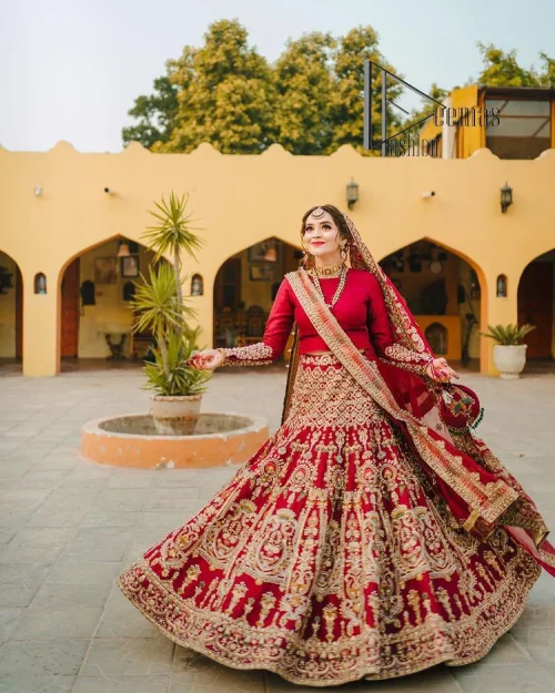 There is a shade of deep red for every bride. This Pakistani reception article begins with a deep red blouse