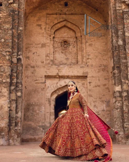 Happy is the bride the maroon shines on. Initiate this Pakistani reception outfit with a maroon heavy Anarkali which is