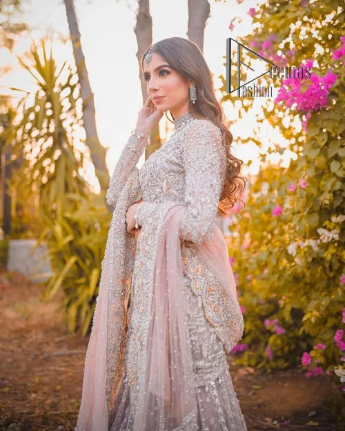 Introducing the mauve nikah outfit which begins with a short shirt that is meticulously and laboriously hand-rendered with silver embroidery