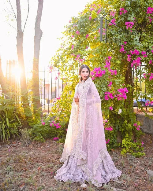 Introducing the mauve nikah outfit which begins with a short shirt that is meticulously and laboriously hand-rendered with silver embroidery