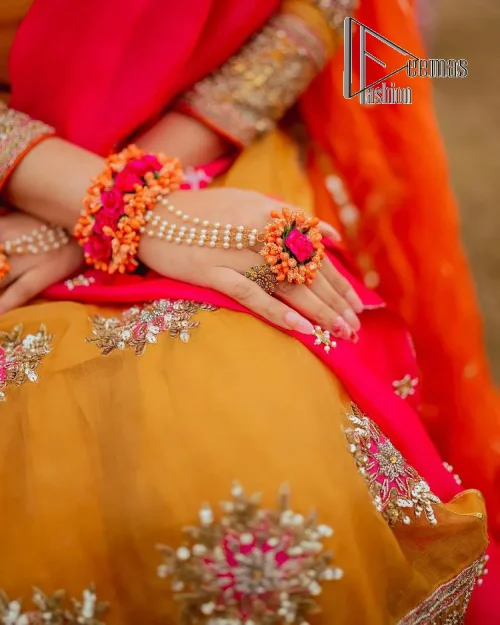 We seek outside the wonders we carry inside us. A mehndi dress in the mustard shirt is enhanced with gorgeous
